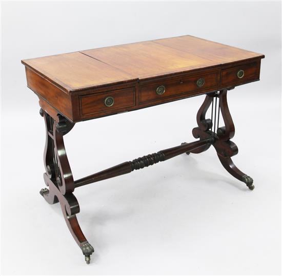 A Regency ebony strung mahogany dressing table, W.3ft 2in. D.2ft 10in. H.2ft 5in.